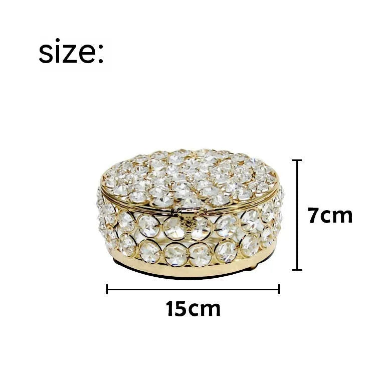 Crystal glass jewellery box with transparent sides and a French gold metal frame.