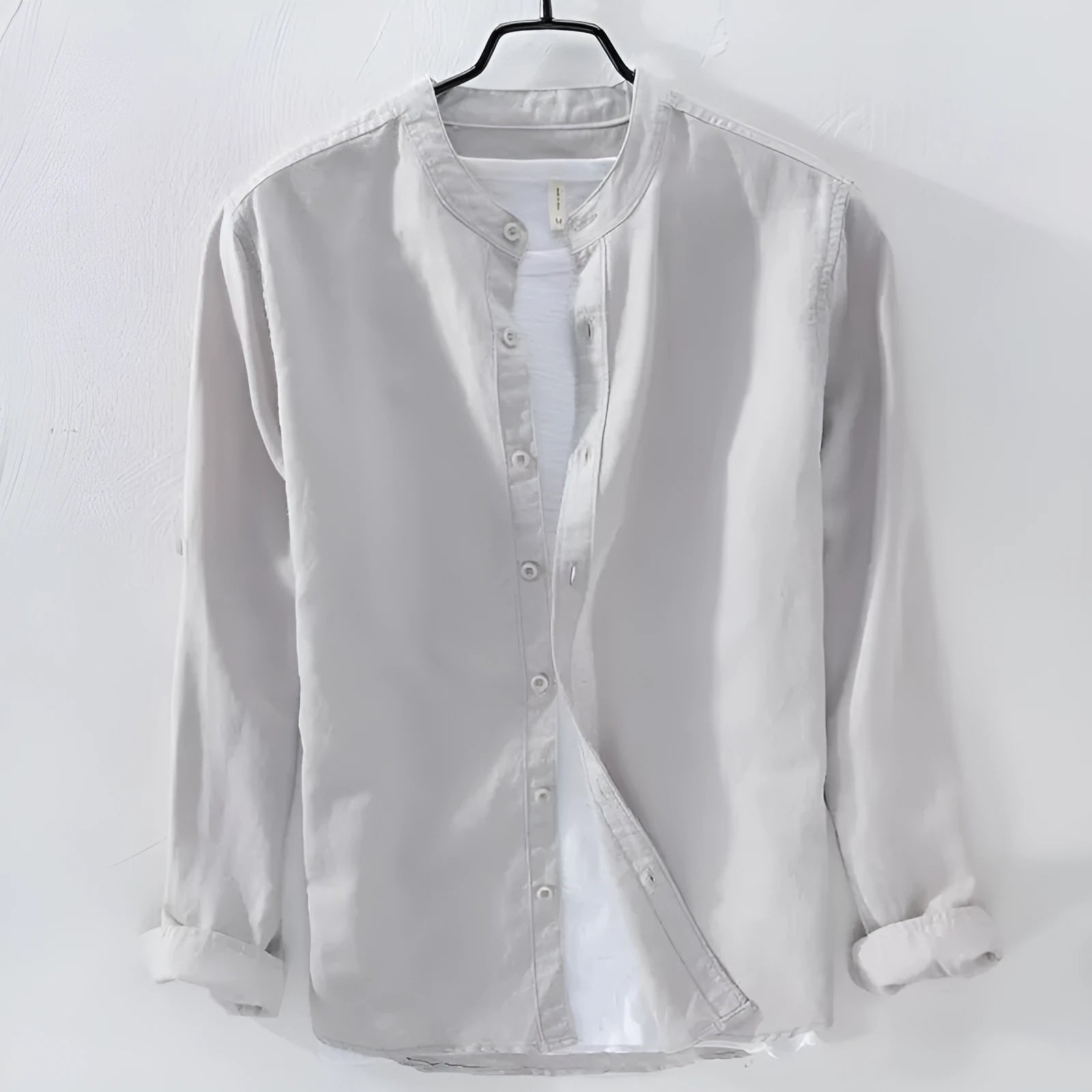 Men's loose long sleeve linen casual shirt in solid colour, shown on a hanger.