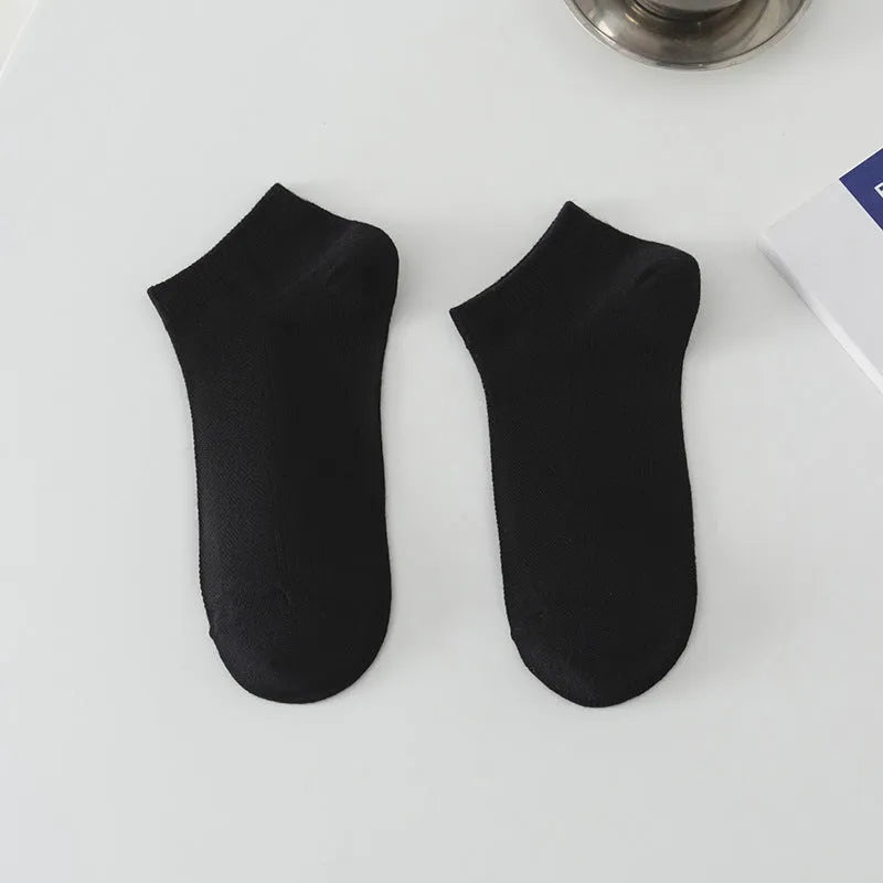 Men's solid colour polyester low-cut boat socks shown in one of six available colour options