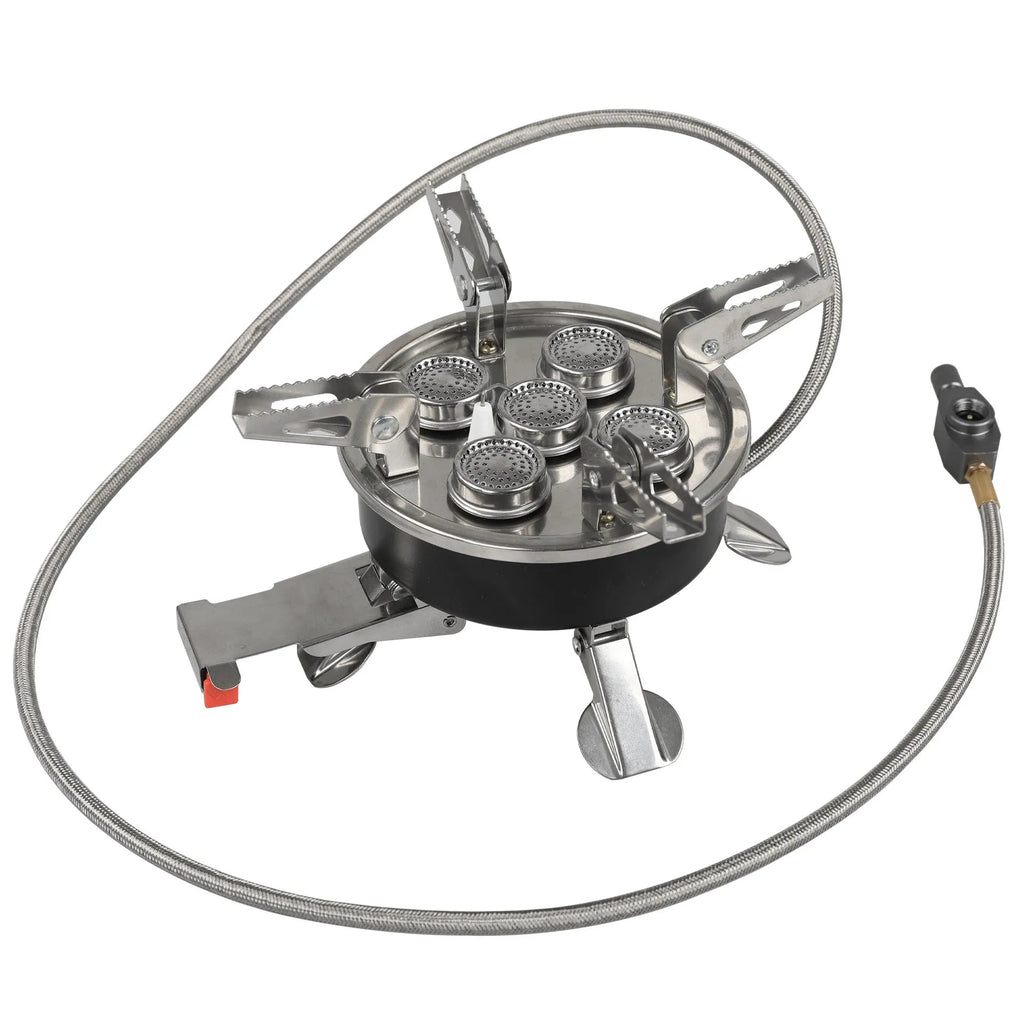 Silver portable folding camping gas stove made of stainless steel and copper with a long black hose.
