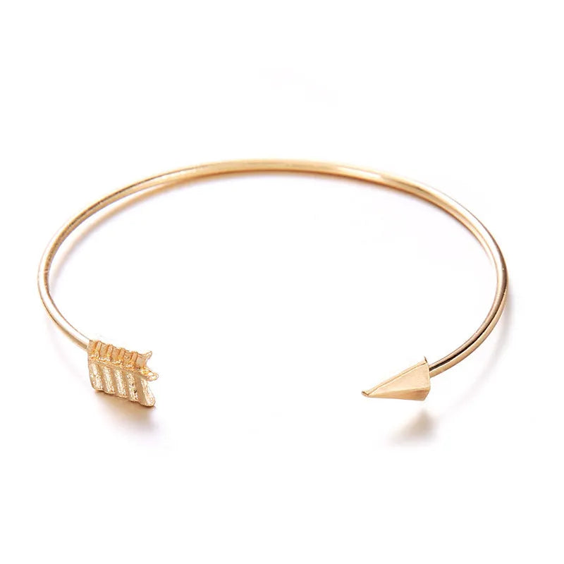 Women's vintage gold arrow knotted cuff bracelet made from electroplated alloy.