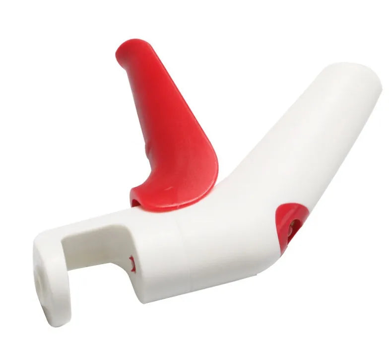 Manual handheld cherry kernel remover kitchen gadget with stainless steel blades and clear pit catcher.