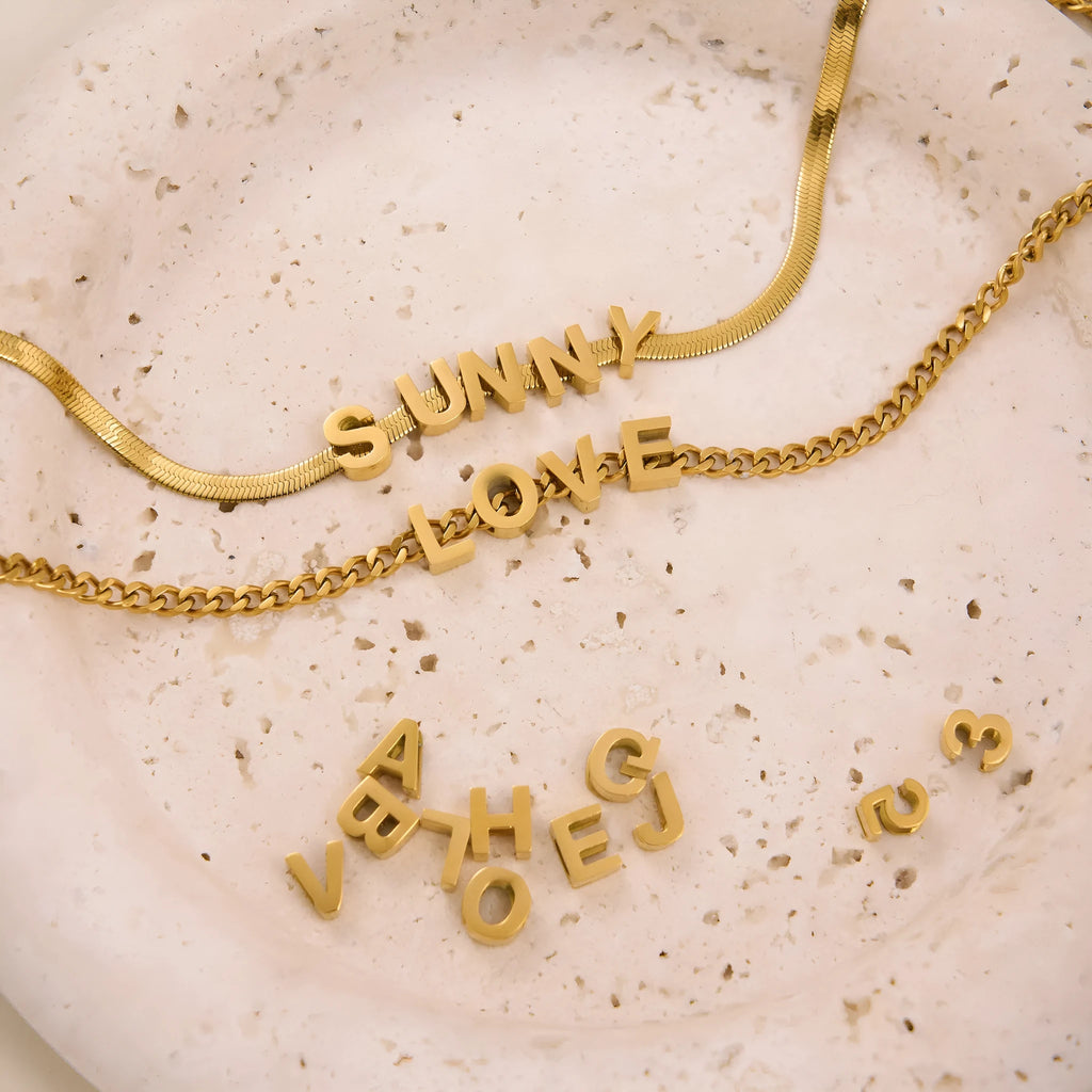Titanium steel number and letter necklace with gold electroplated finish on grinding chain design