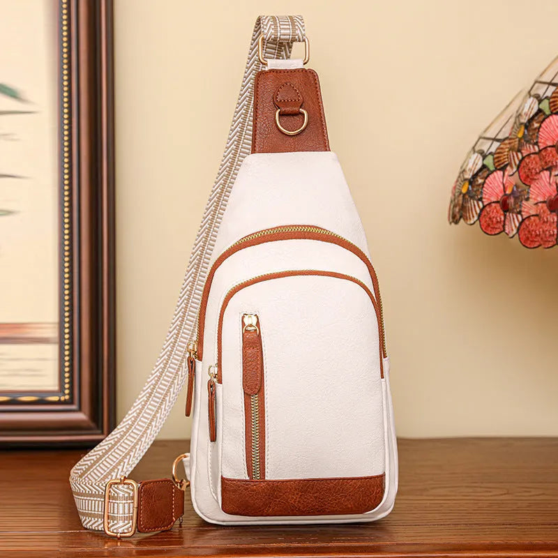 Soft brown women's crossbody chest bag showing zip compartments and street-style sewing thread detail