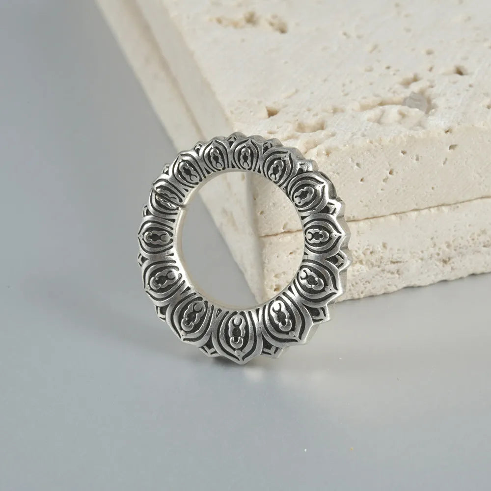 Retro heart-shaped hollow lotus magnetic earrings in stainless steel with antique finishes