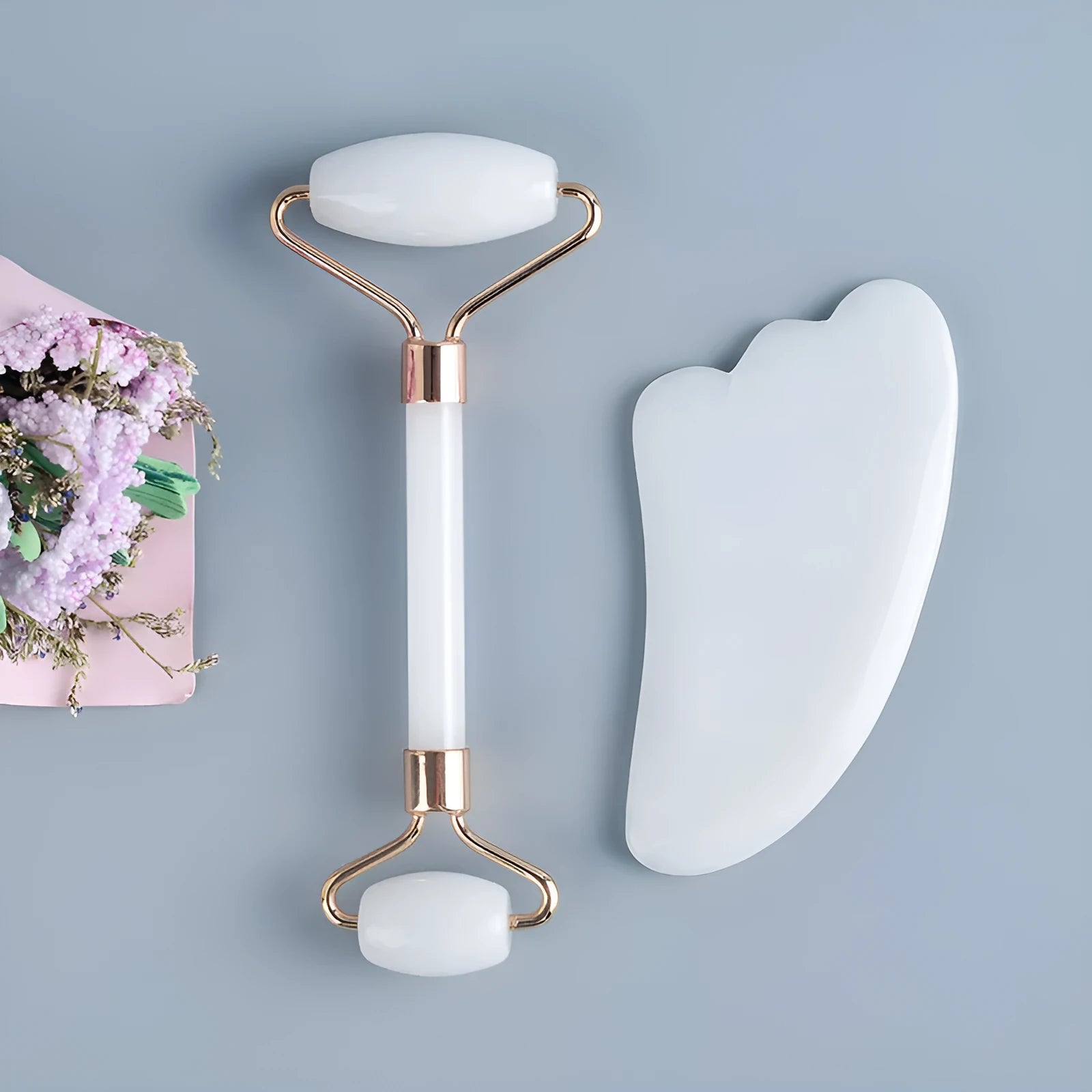 White jade facial roller and gua sha board set for skincare massage