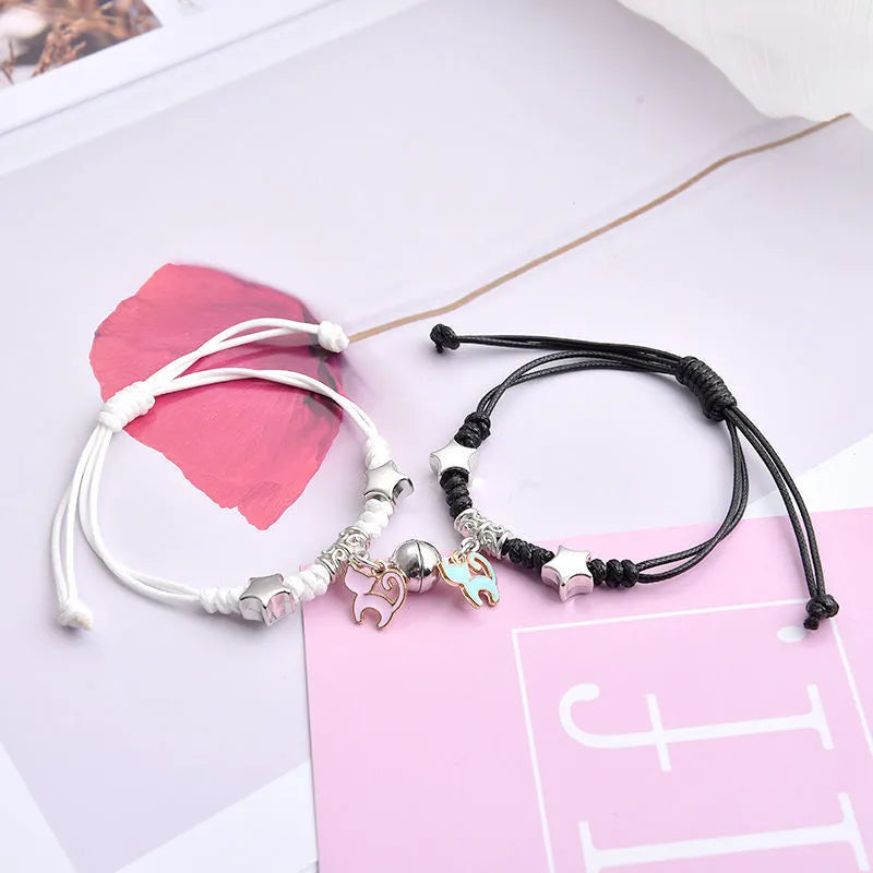 Magnetic couple bracelet pair with alloy electroplating in various designs including clover and crown patterns