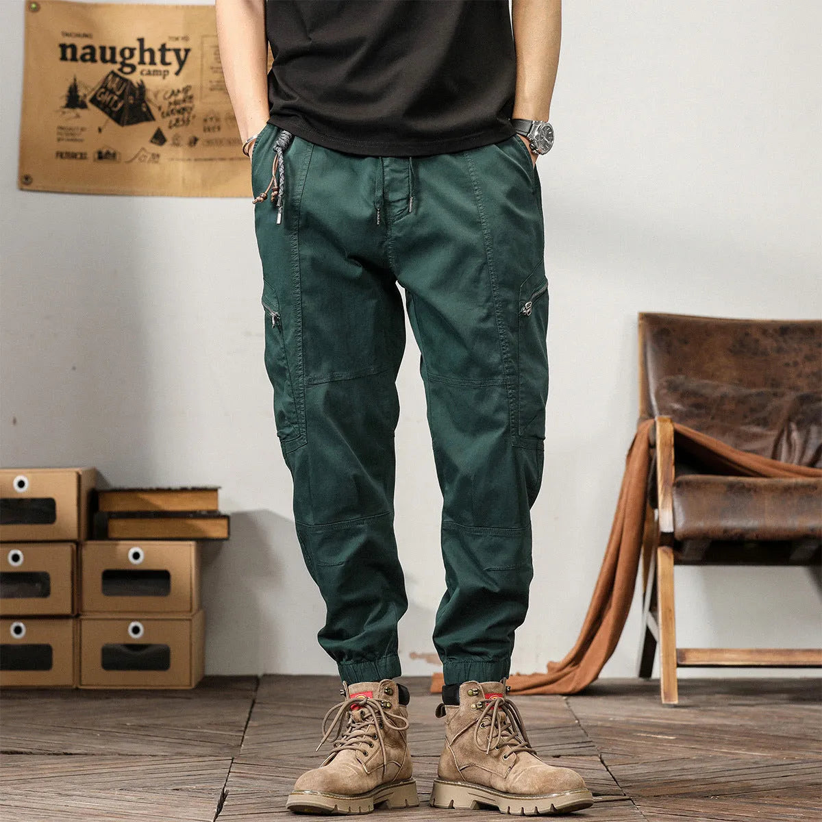 Men's khaki cotton harem pants with tapered ankle bands and a mid-waist zip fly.