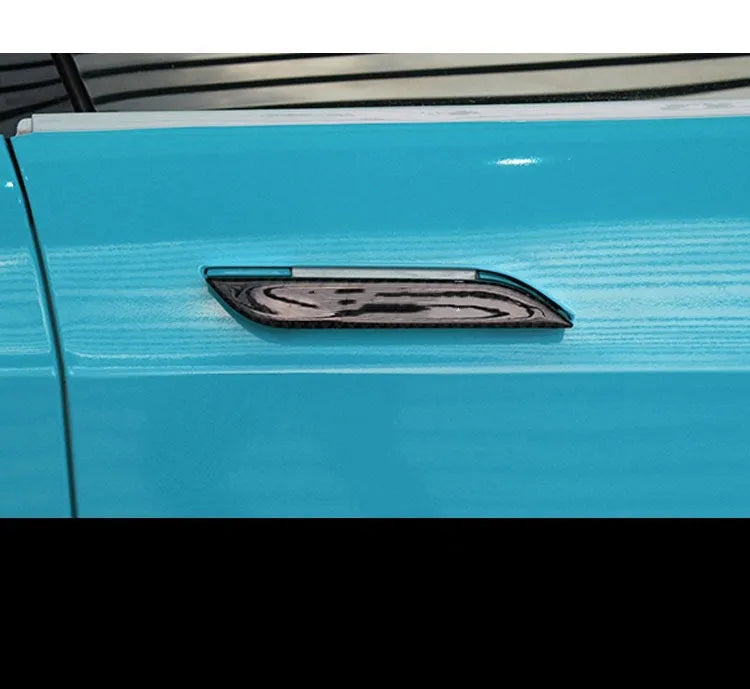 Carbon fibre door handle protective stickers for Tesla Model S, showing adhesive drip pattern.