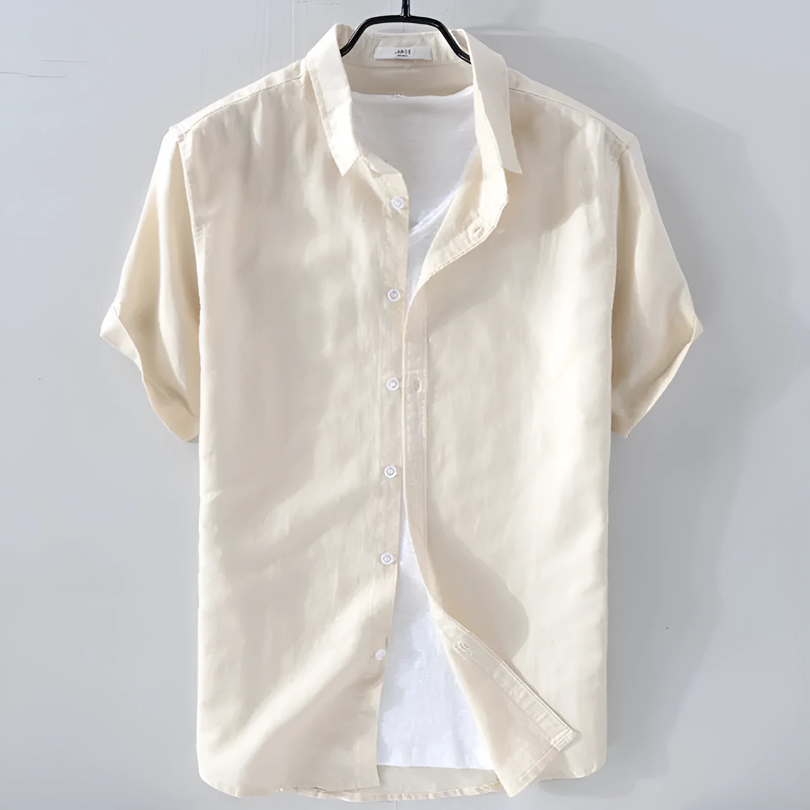 Men's loose fit short sleeve linen shirt in a cotton and linen blend, shown in apricot colour.
