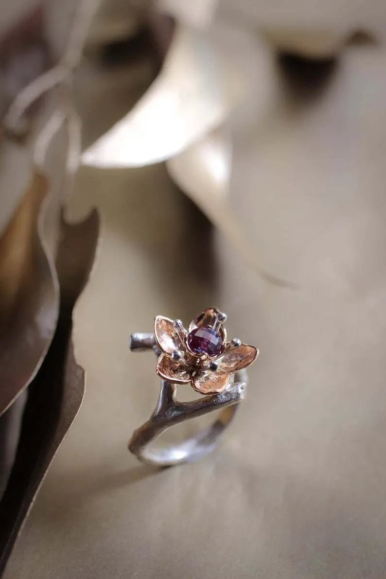 Silver two-tone floral geometric women's ring showing alloy construction and contemporary design