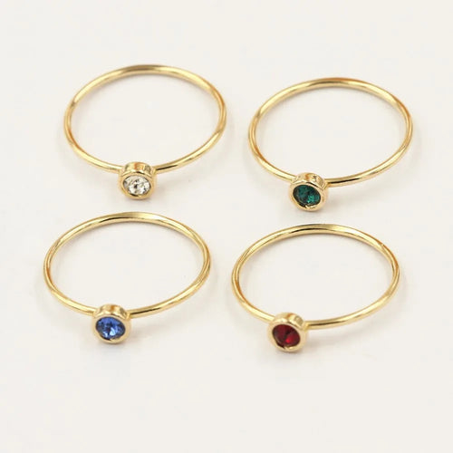 14K gold-plated GF zircon knuckle ring on finger in green colour