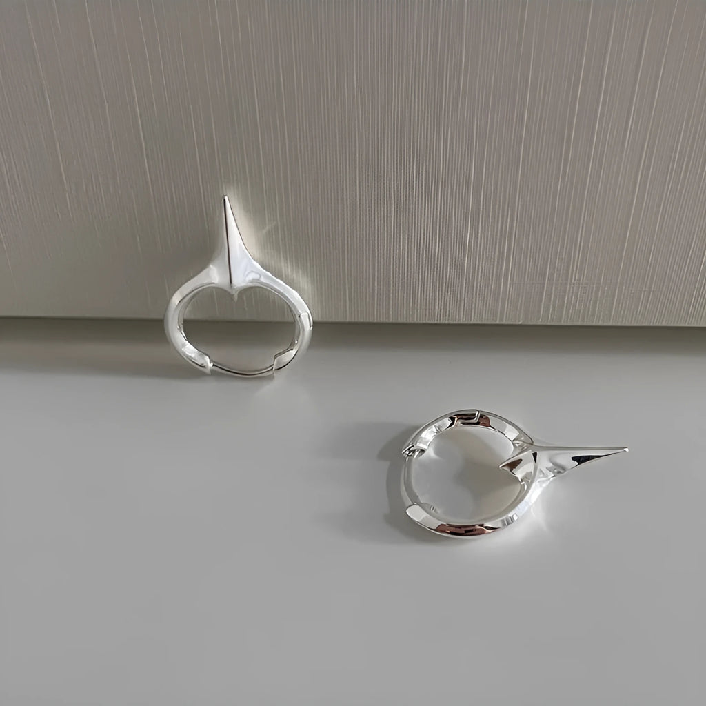 Geometric star shaped ear clips for women with electroplated copper construction and white gold plating