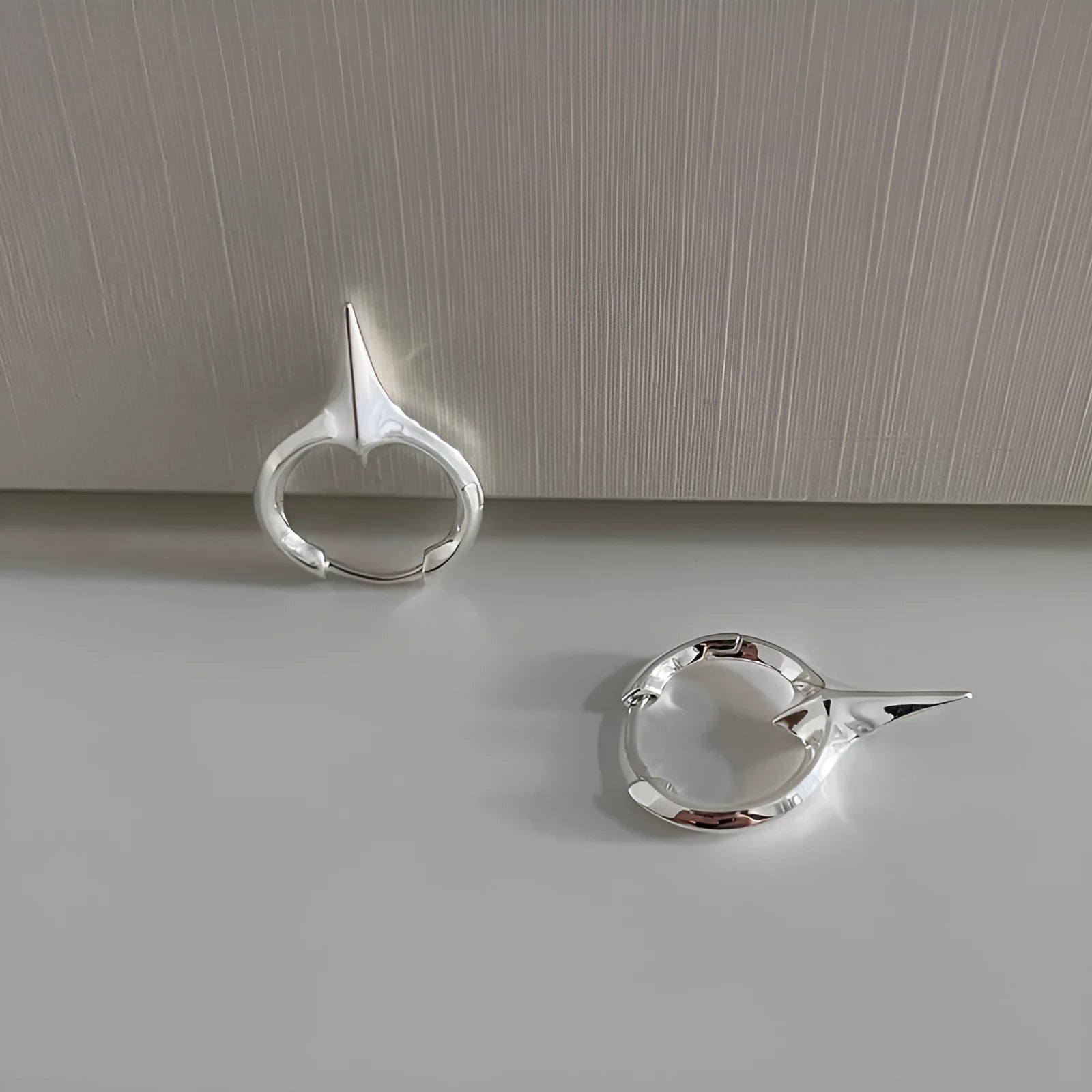 Geometric star shaped ear clips for women with electroplated copper construction and white gold plating