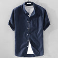 Men's loose fit short sleeve linen shirt in a cotton and linen blend, shown in apricot colour.