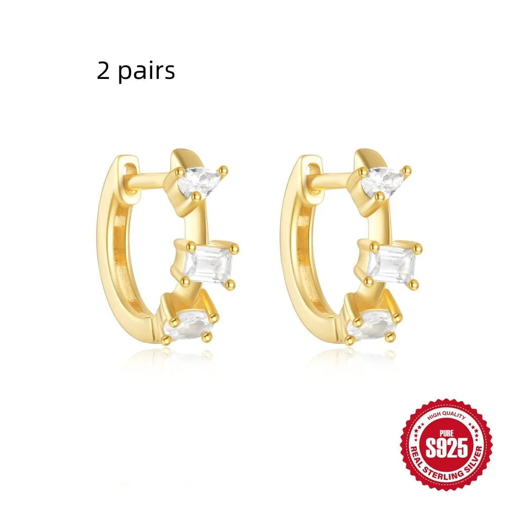 Sterling silver geometric stud earrings with small round diamond accents in gold or silver electroplated finish