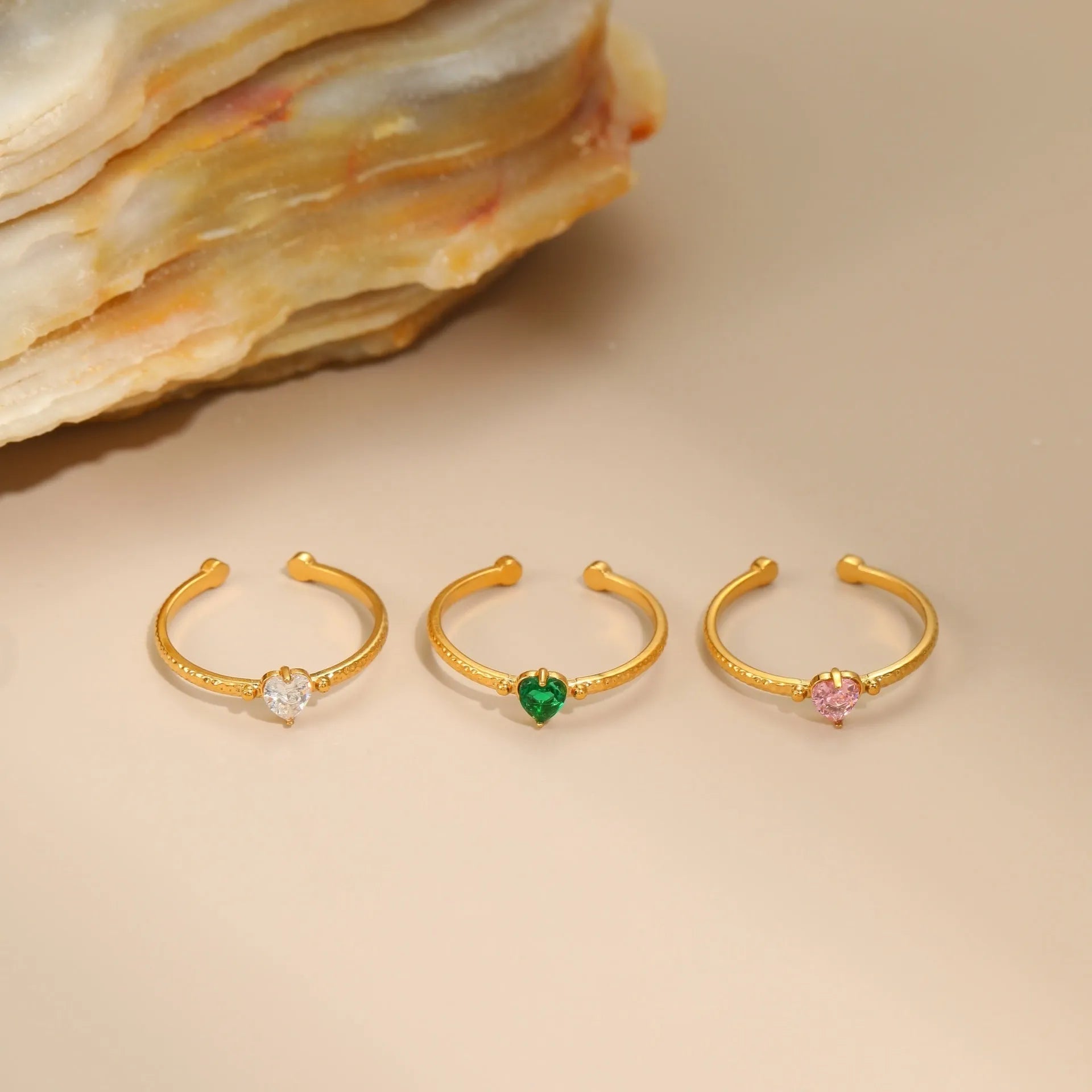 Open ended geometric stainless steel ring with a coloured zircon love heart inlay.