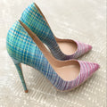 Pink and blue gradient women's high heel shoes with pointed toe and thin high heel on a plain background.
