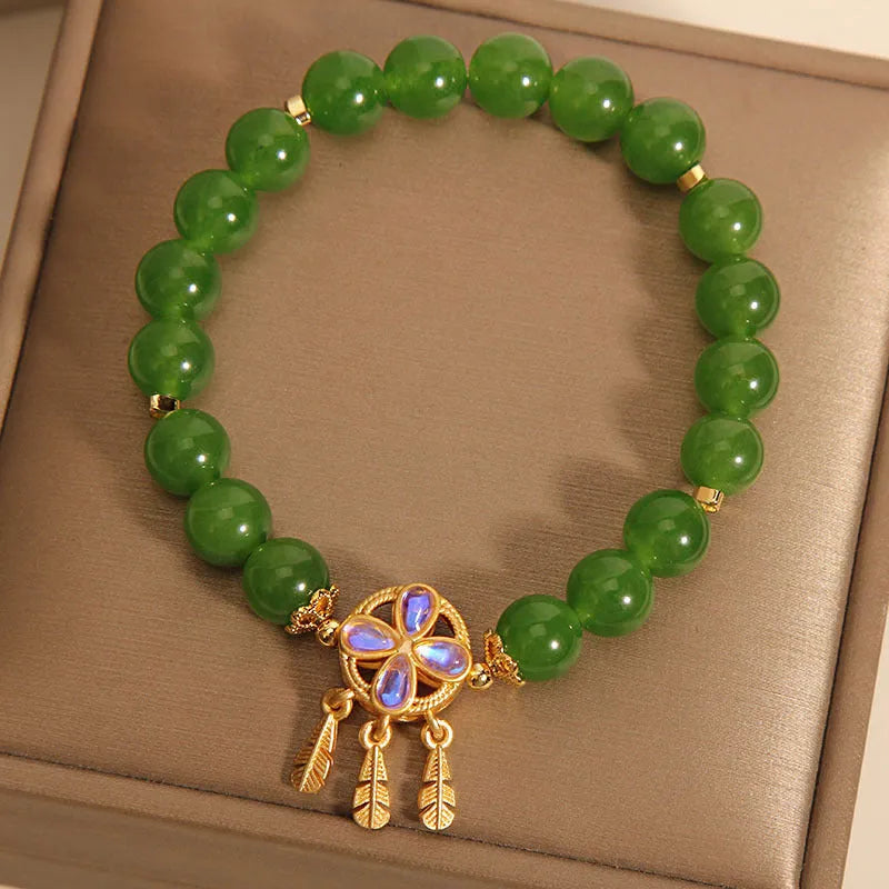 Green jasper bracelet for women with a crystal four-leaf clover dream catcher pendant.