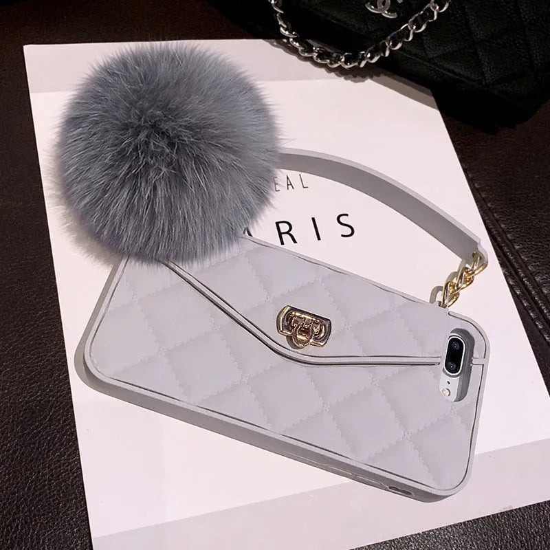 iPhone fluffy hairball plush phone case in dark green grid pattern made from flexible TPU material.