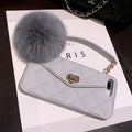 iPhone fluffy hairball plush phone case in dark green grid pattern made from flexible TPU material.