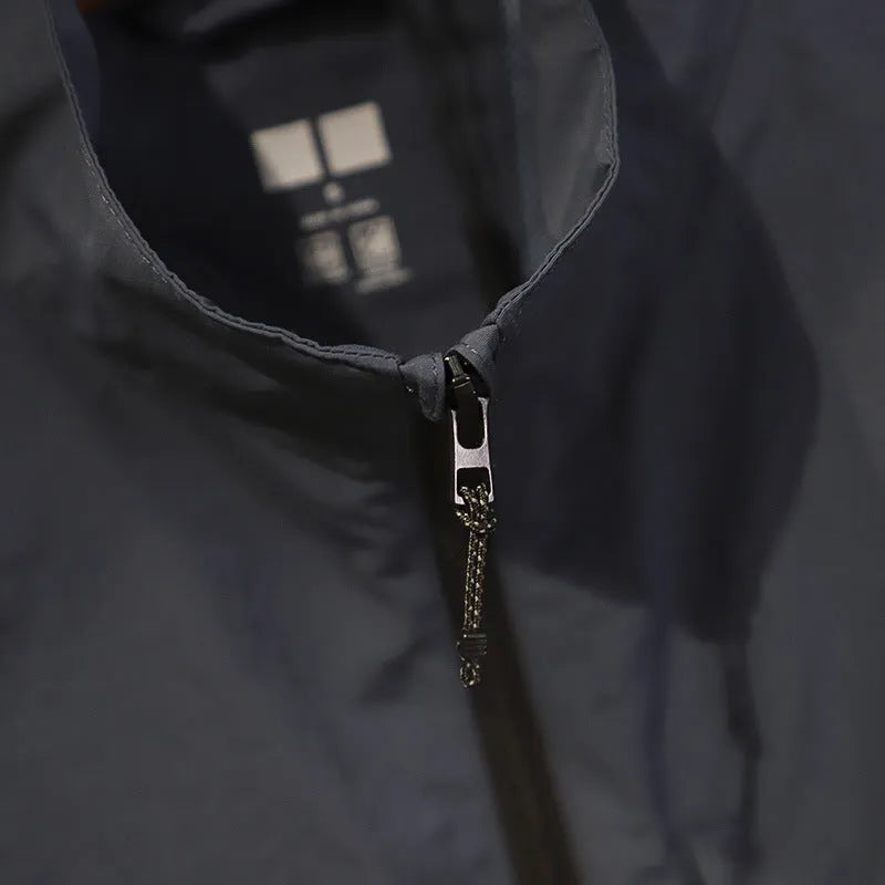 Men's thin nylon vest in straight cut with side pockets, shown in Army Green colour.