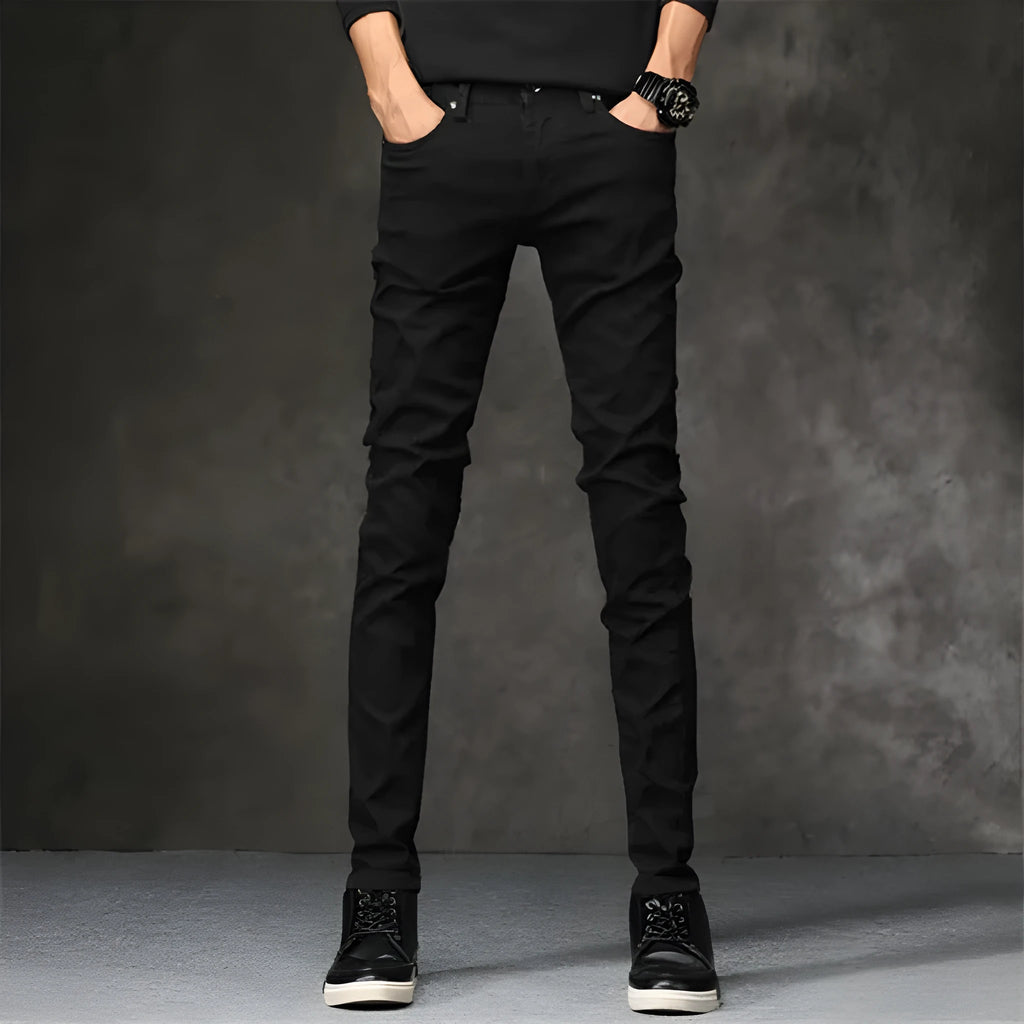 Slim-fit stretch cotton men's pants in black, laid flat showing tight cut and full length