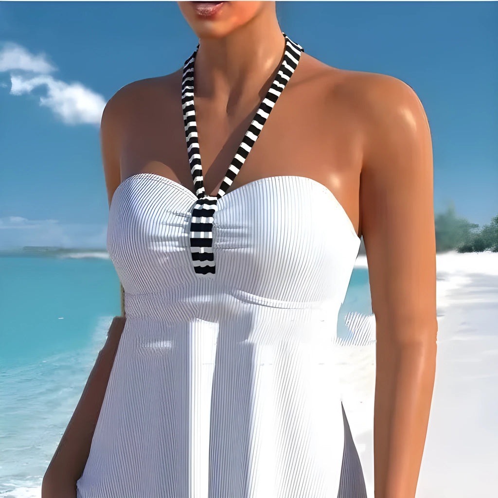 Women's solid colour striped off-shoulder one-piece swimsuit on a mannequin, showing the briefs style and removable lining.