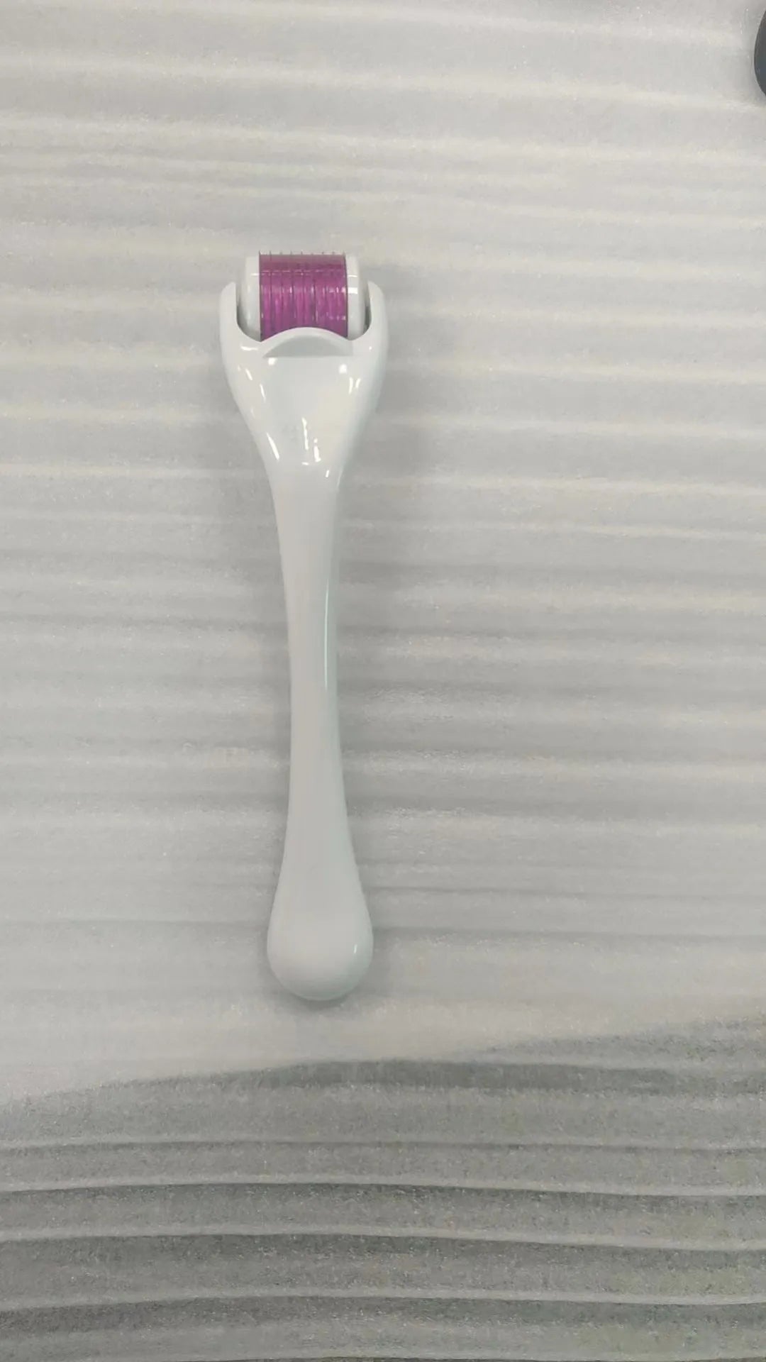 Sterile micro needle derma roller with PC handle in selected colour and 0.2mm, 0.25mm, or 0.3mm needle wheel.