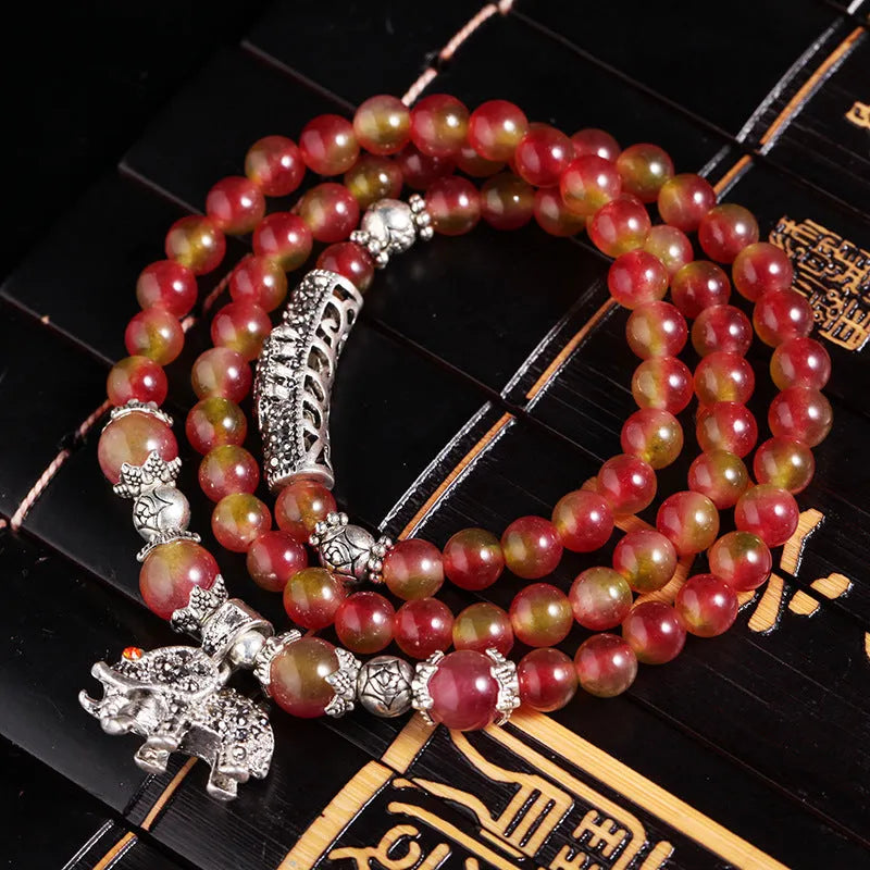 Handmade natural watermelon crystal bracelet with Chinese knot closure in geometric national style design