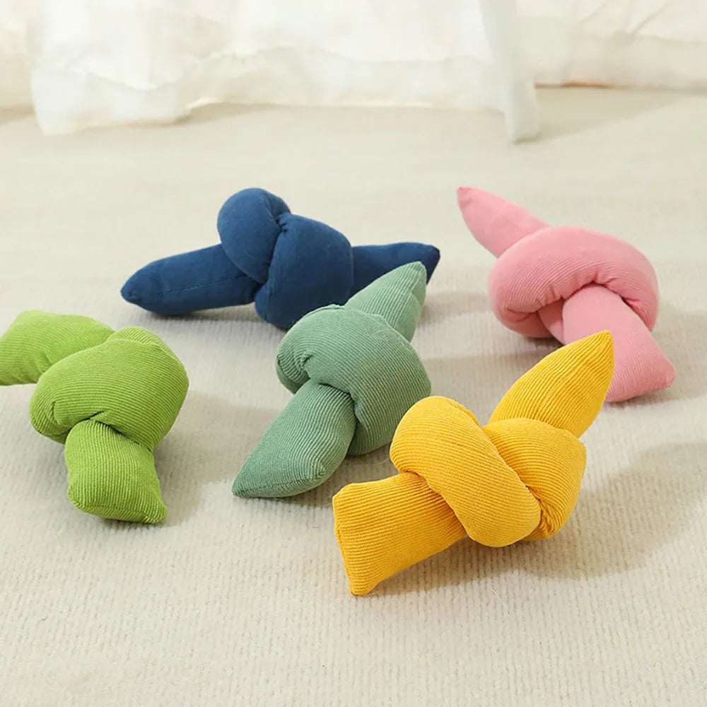 White cotton knotted rope bone dog toy for tug of war and chewing.