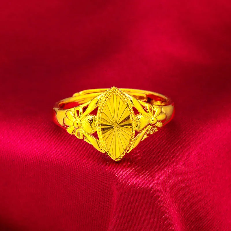 Alluvial gold open diamond flower ring with geometric textured design on brass with electroplated finish.
