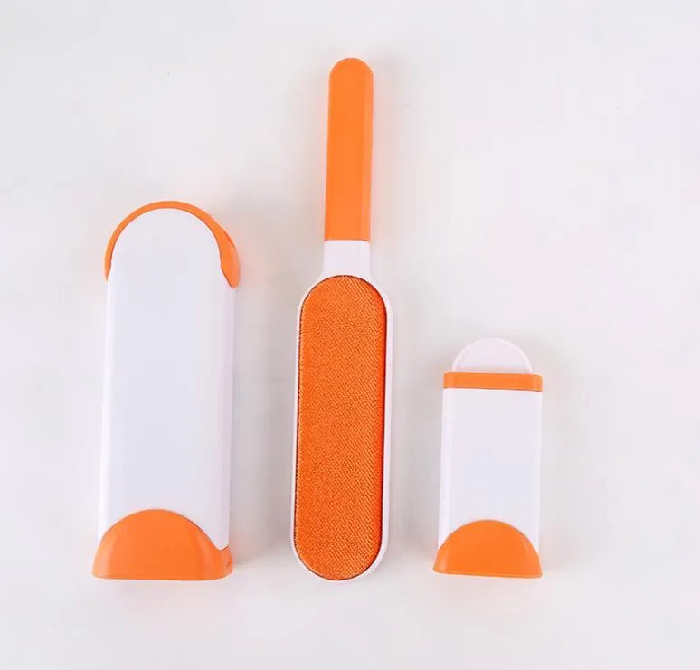 Blue reusable pet hair removal comb with double-sided brush head next to its self-cleaning base.