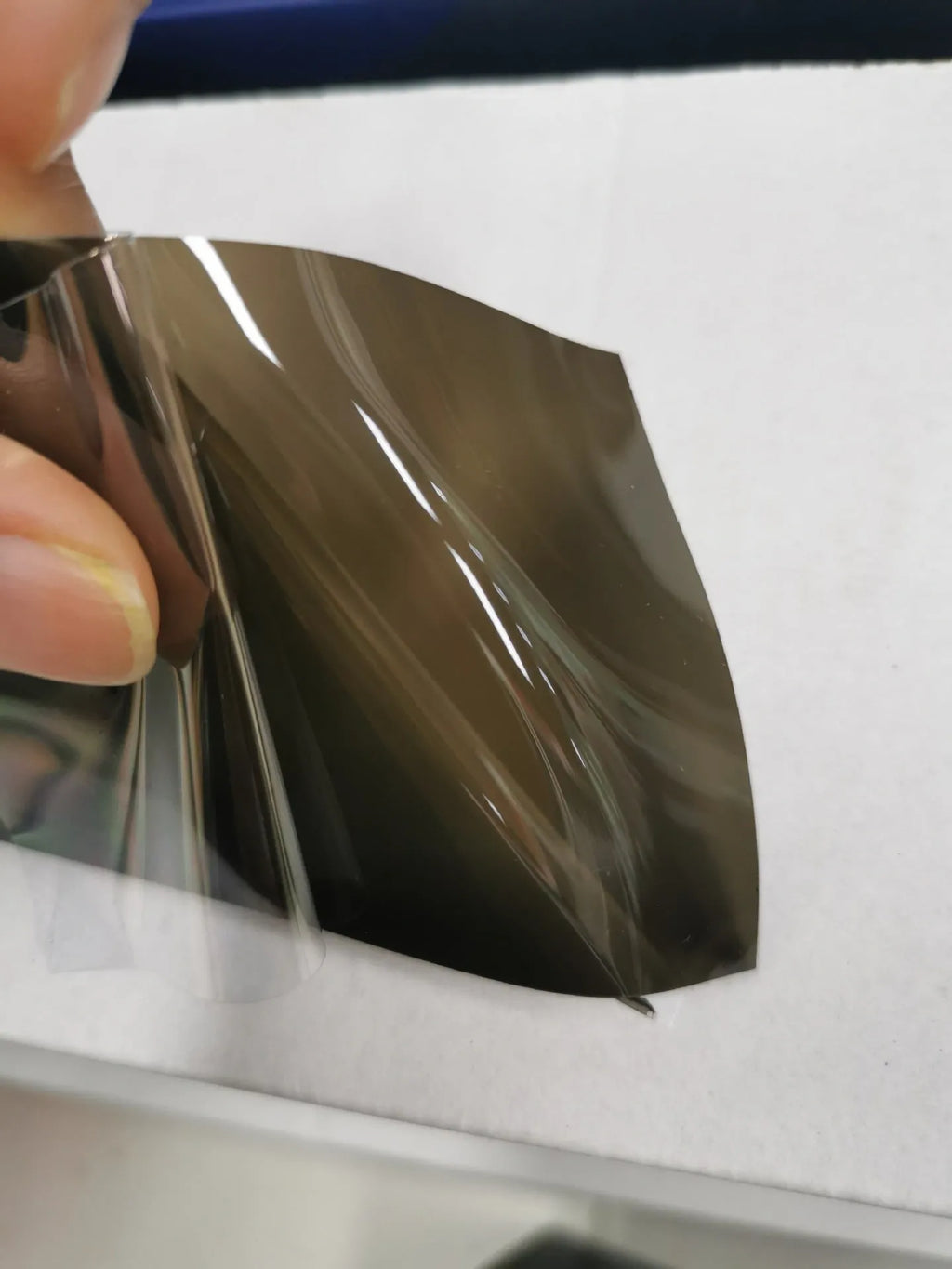 30cm wide plastic car lamp protective film on LED headlight showing transparent protection