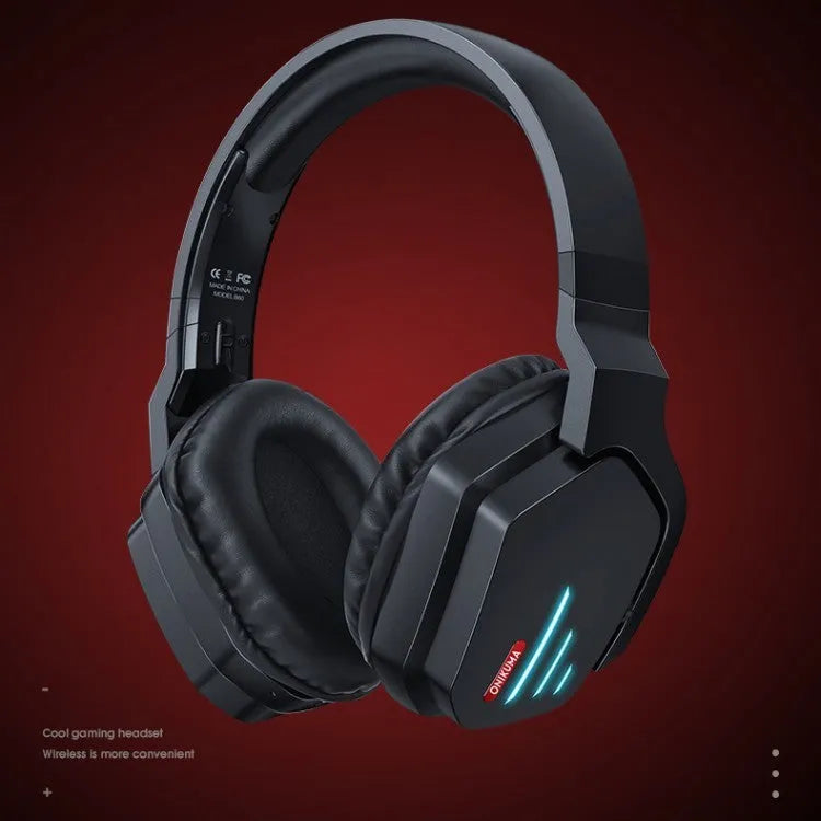 Luminous black wireless gaming headphones showing head-mounted design and included 3.5mm cable.