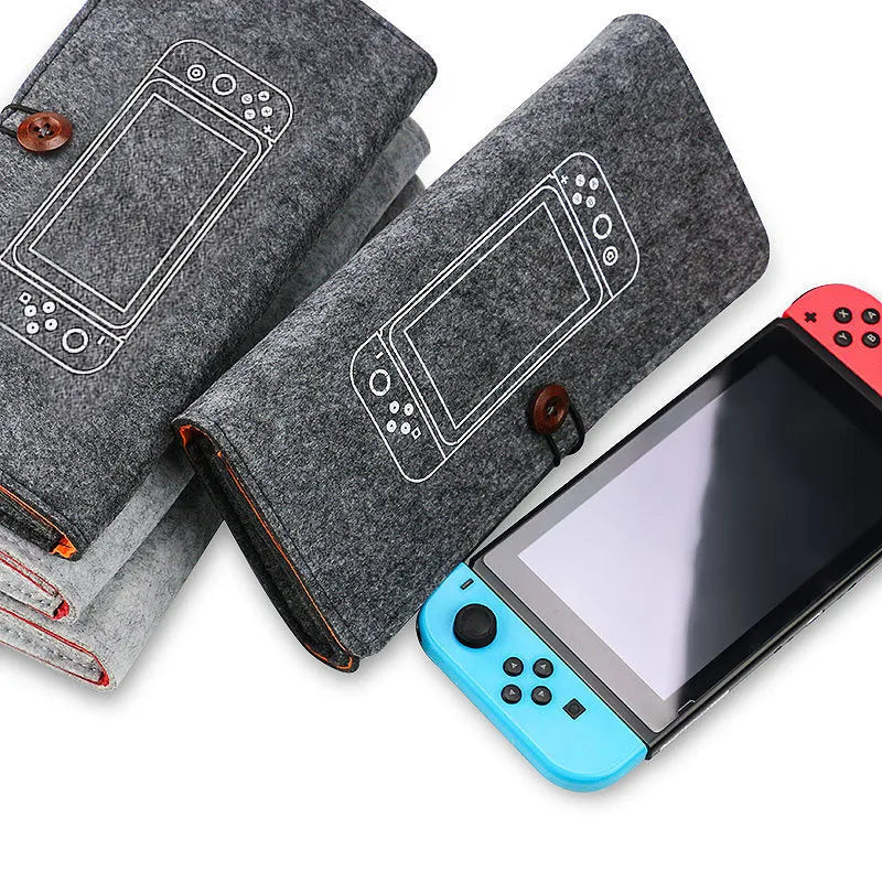 Black felt storage pouch for Nintendo Switch console with game cartridge slots open.
