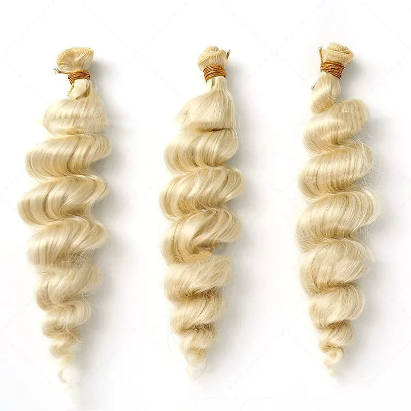 Golden synthetic hair weft wig showing length options on a stand.