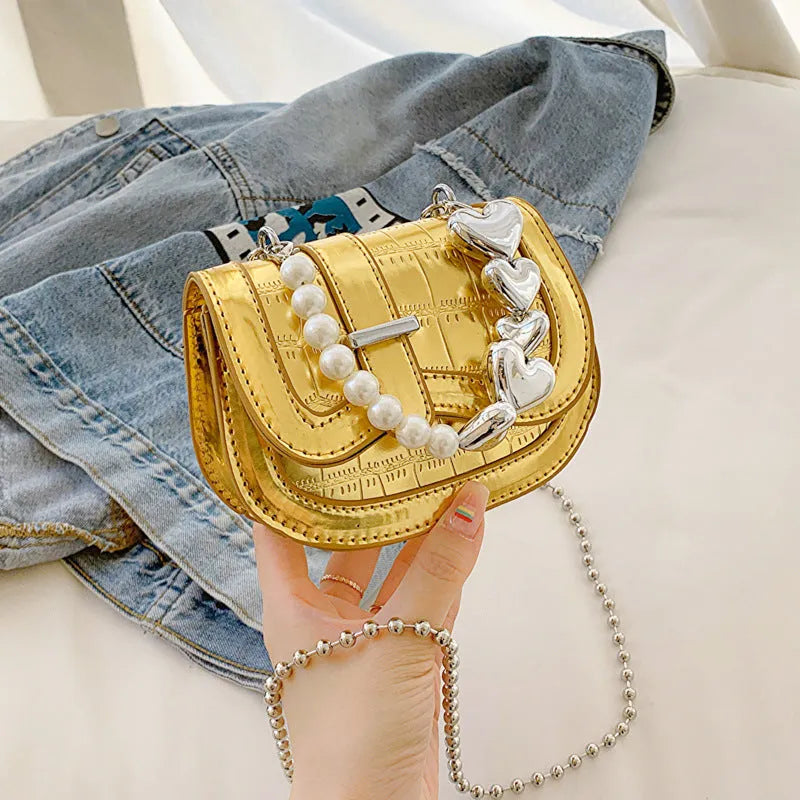 Silver PU leather mini tote saddle crossbody bag for women with a single strap.