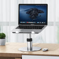 Silver adjustable aluminium alloy car laptop stand with rotating base and non-slip support plate.