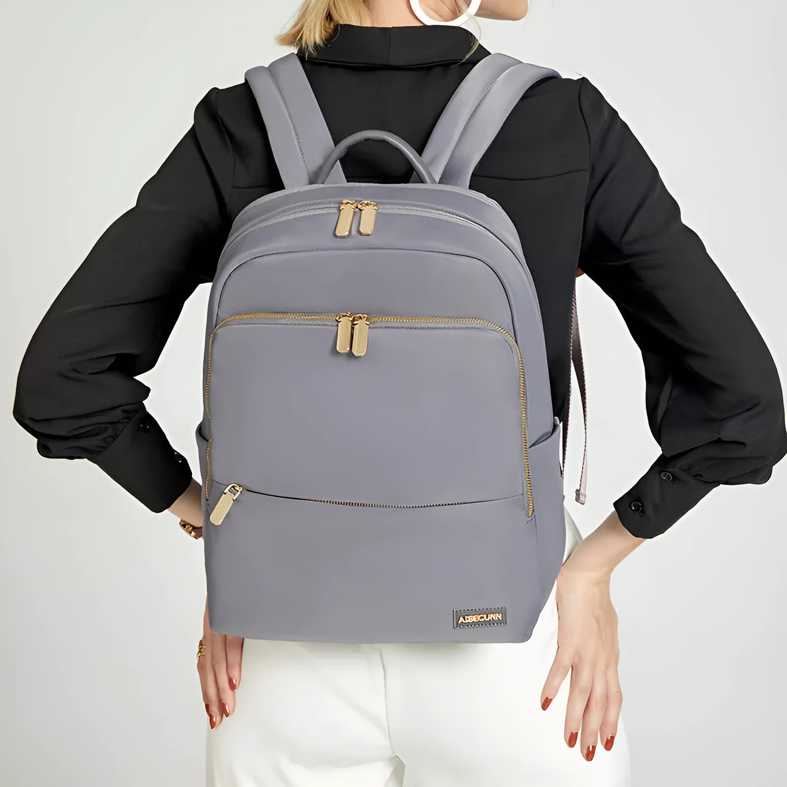 Oxford cloth women's backpack with mesh back panel and adjustable straps in black or purplish grey
