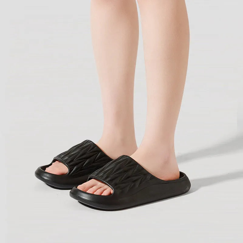 Leaf texture design EVA indoor slippers in multiple colours on a white background.