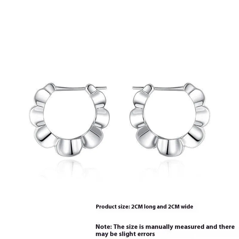 Pair of geometric sterling silver earrings with circular design element and electroplated finish