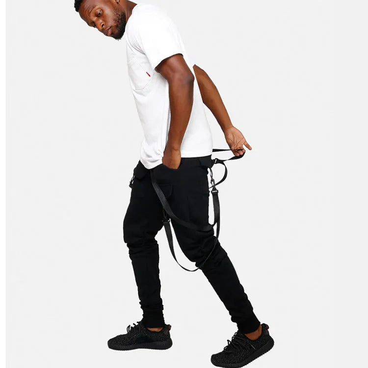 Men's black cotton blend pencil sweatpants with belt, flat lay showing tapered leg and waist elastic