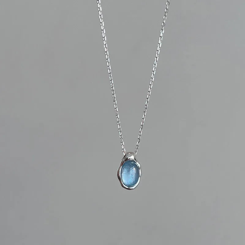 Women's navy blue water drop pendant necklace on adjustable copper cross chain