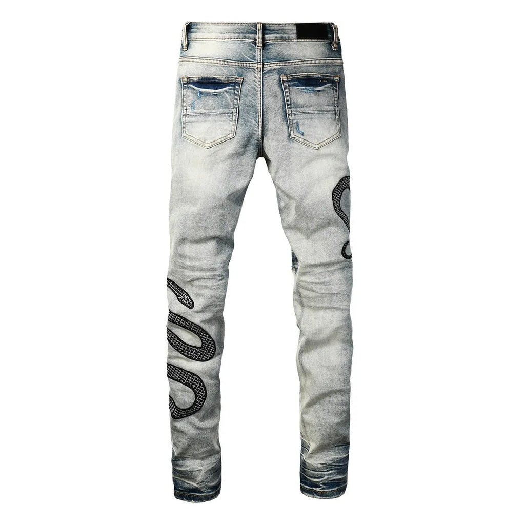 Men's blue distressed skinny jeans with a wash effect and button fly