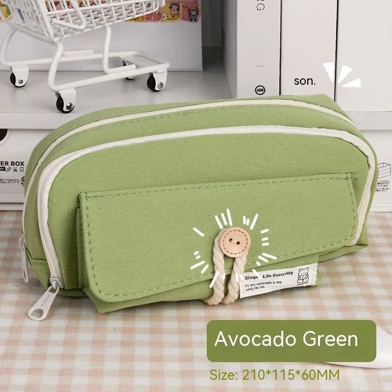 Korean style canvas pencil case in green holding multiple pens