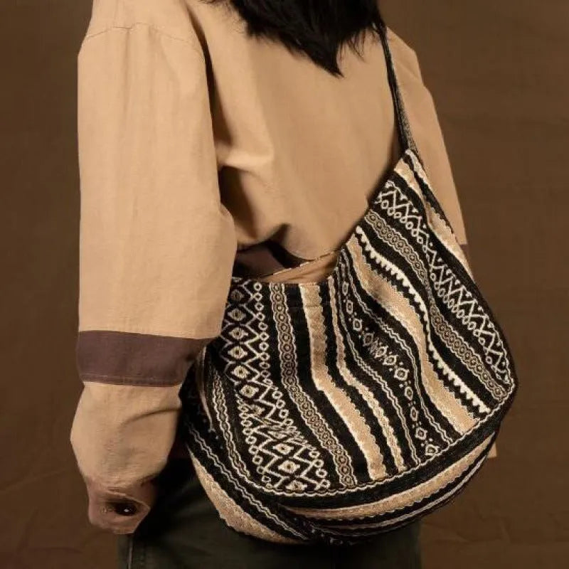 Retro striped corduroy messenger bag with adjustable plaid shoulder strap and zipper closure