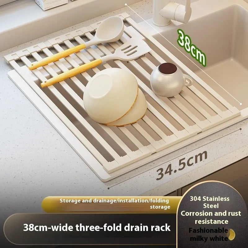 A milky white foldable stainless steel kitchen draining rack shown open on a countertop next to a sink.