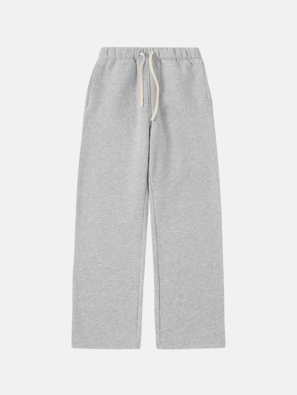 Man wearing black fleece-lined loose-fit sweatpants with an elastic drawstring waist