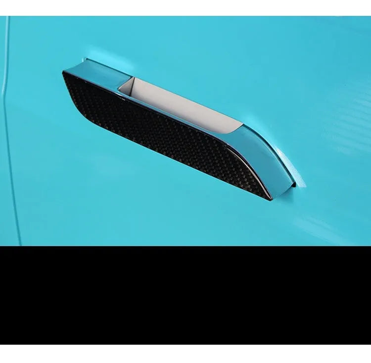 Carbon fibre door handle protective stickers for Tesla Model S, showing adhesive drip pattern.
